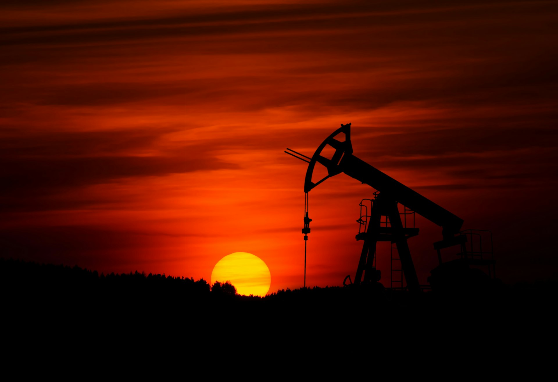 Oil pump jack at sunset